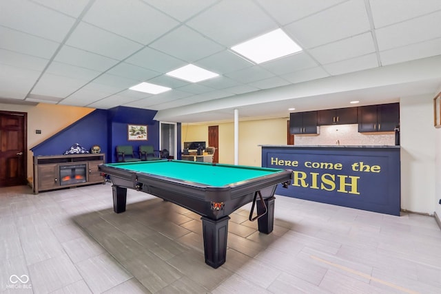 playroom with a paneled ceiling and pool table