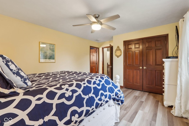 bedroom featuring a closet, ceiling fan, and light hardwood / wood-style flooring