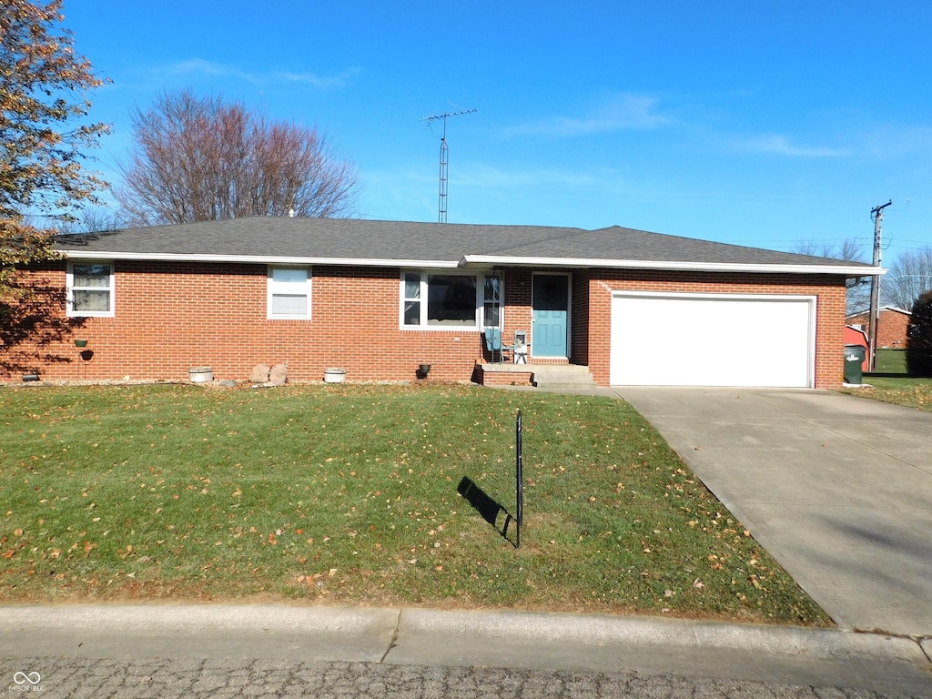 ranch-style house with a front lawn and a garage