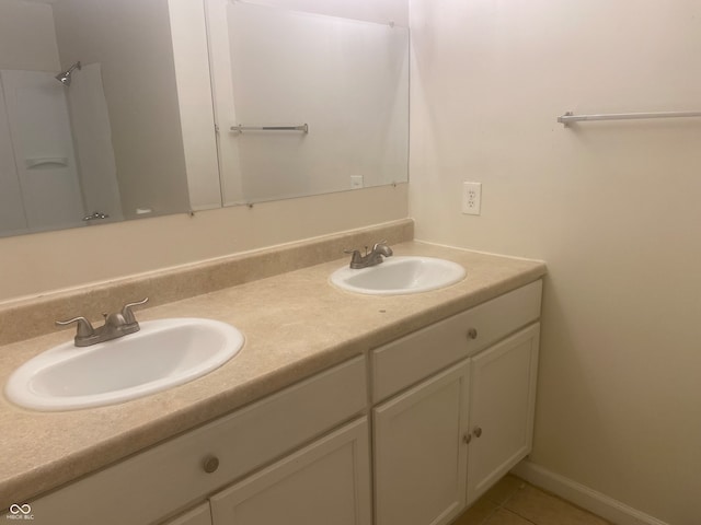 bathroom featuring tile patterned flooring and vanity