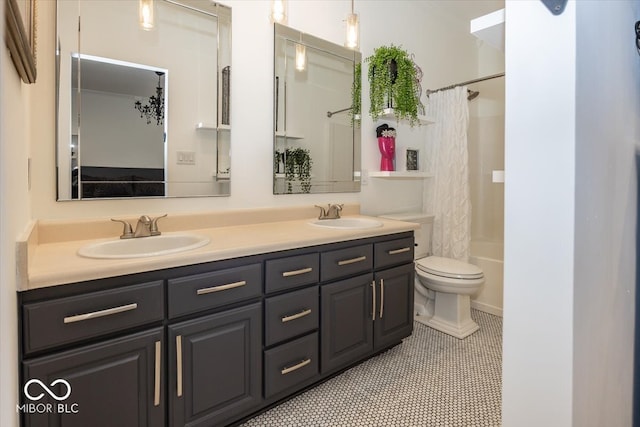 full bathroom featuring tile patterned floors, shower / bath combo with shower curtain, vanity, and toilet