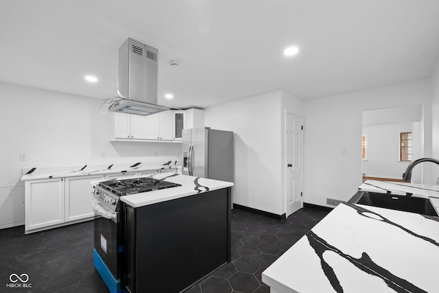 kitchen with black gas range, sink, a kitchen island, white cabinetry, and extractor fan