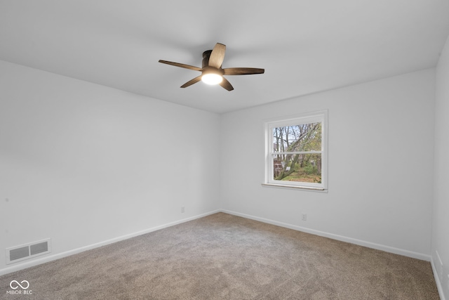 carpeted empty room with ceiling fan