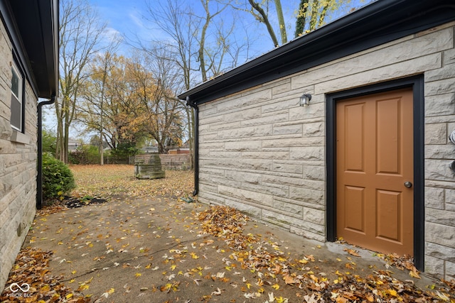 view of side of home with a patio area