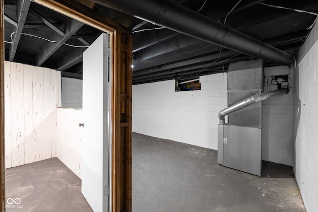 basement featuring heating unit