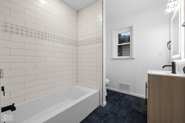 full bathroom featuring toilet, vanity, tile patterned floors, and tiled shower / bath combo