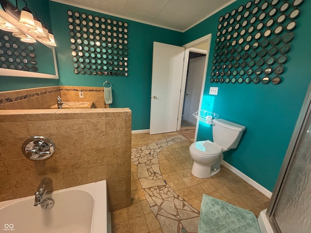 bathroom featuring a tub to relax in, crown molding, tile patterned flooring, and toilet