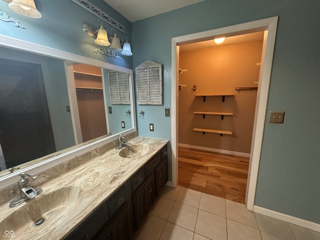 bathroom with vanity and tile patterned floors