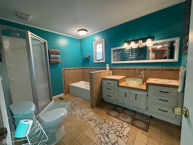 full bathroom featuring tile patterned floors, vanity, separate shower and tub, and toilet