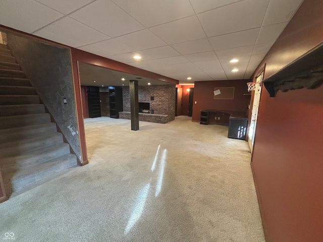 basement with carpet and a drop ceiling