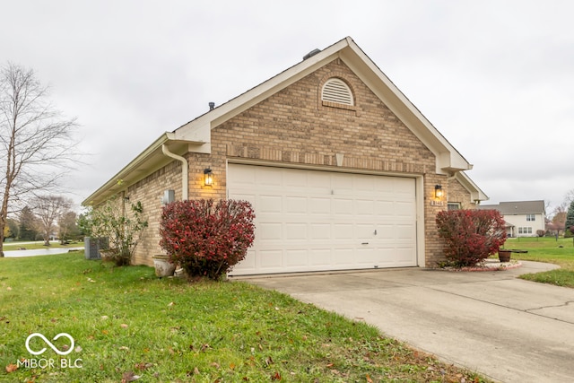 view of home's exterior featuring a lawn and a garage