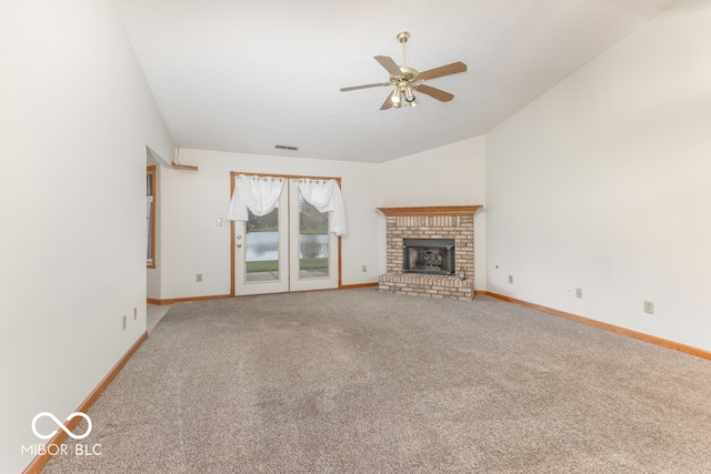 unfurnished living room featuring ceiling fan, carpet floors, and vaulted ceiling