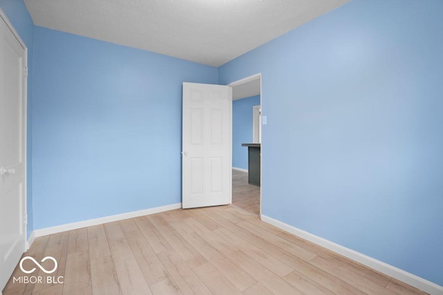 unfurnished room featuring light wood-type flooring