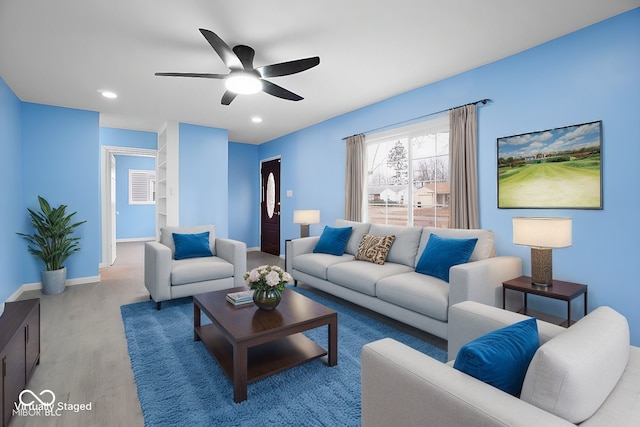 living room featuring ceiling fan