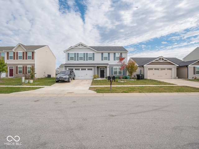 view of front of property with a garage and a front lawn