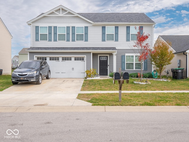 view of front facade featuring a front yard and a garage