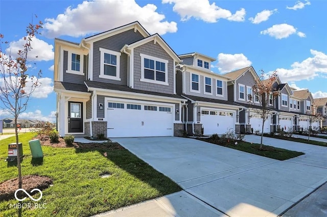 view of front of home with a front yard and a garage