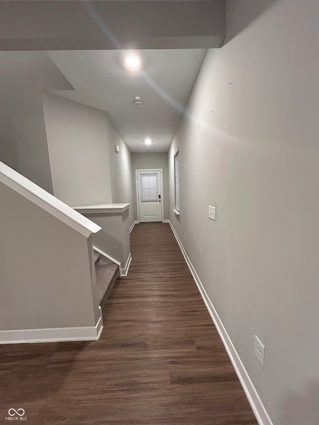 hall featuring dark wood-type flooring