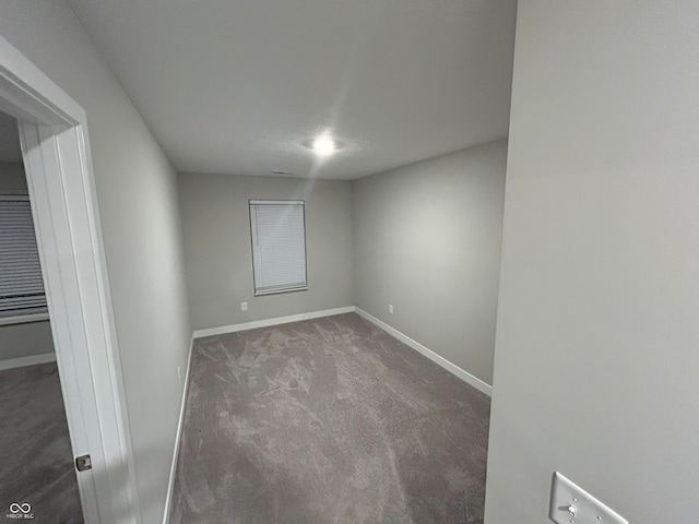 empty room with carpet flooring