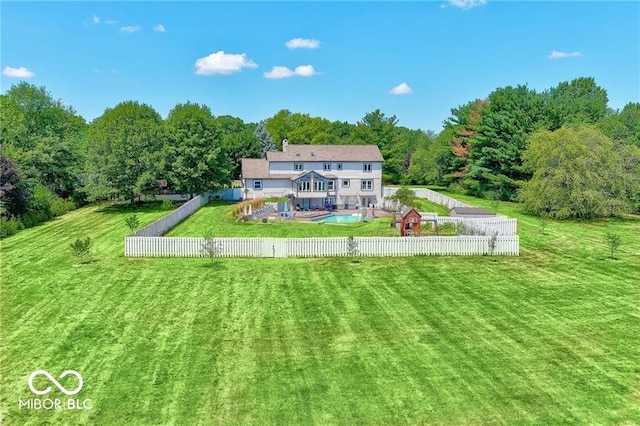 back of house featuring a lawn