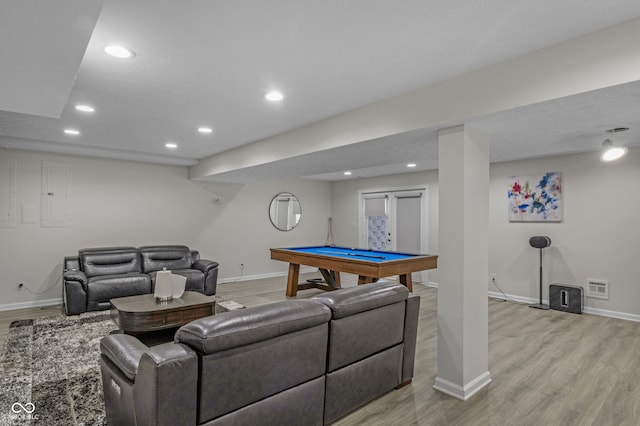 living room with electric panel, light wood-type flooring, and pool table