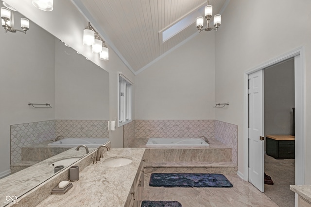 bathroom with tiled tub, vaulted ceiling with skylight, vanity, wood ceiling, and ornamental molding