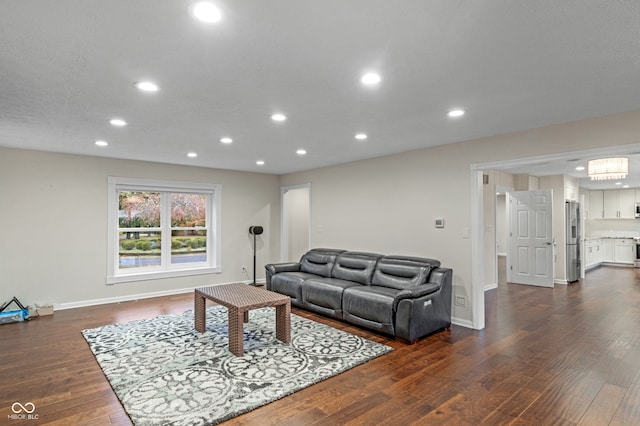 living room with dark hardwood / wood-style flooring