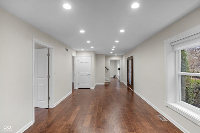 hallway featuring dark wood-type flooring