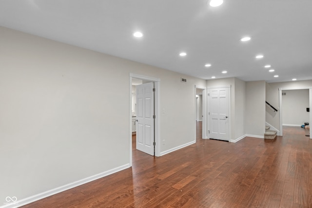 unfurnished room featuring dark hardwood / wood-style flooring