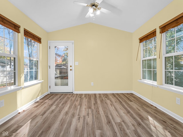 unfurnished sunroom featuring ceiling fan and lofted ceiling