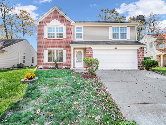 view of front of property with a front yard, a garage, and central air condition unit