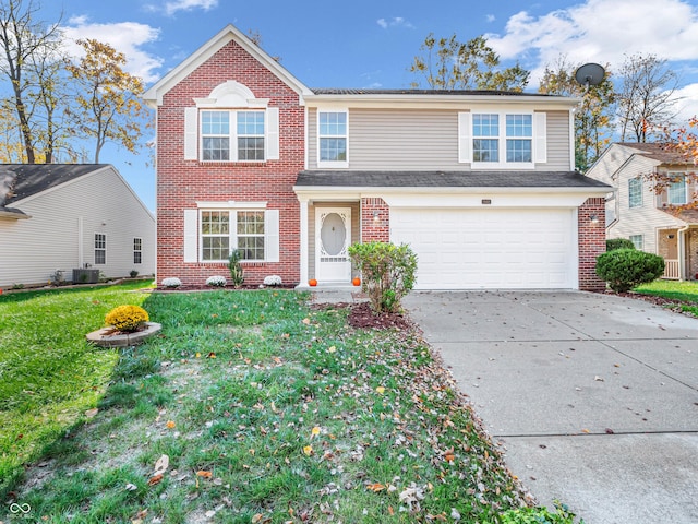 11411 Shady Hollow Ln, Indianapolis, IN 46229 - traditional-style house with brick siding, concrete driveway, a garage, a front lawn, and central AC
