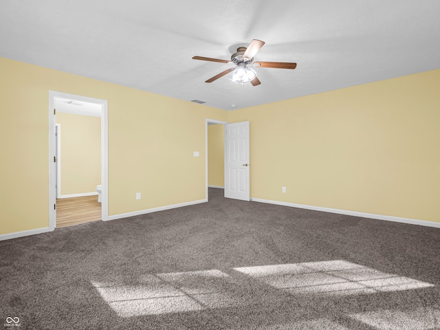 unfurnished room with carpet flooring and ceiling fan