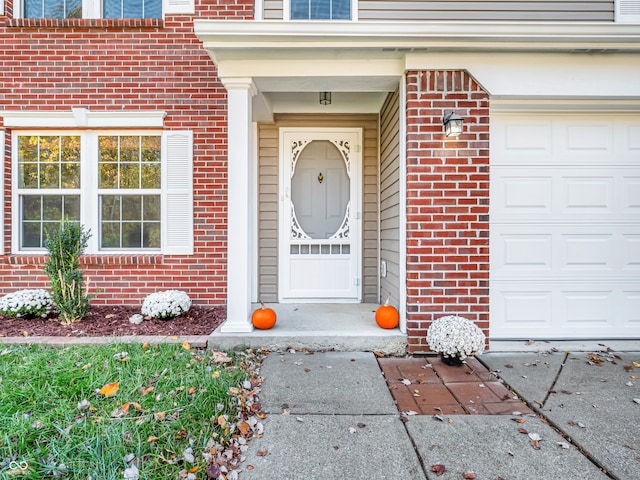 property entrance with a garage