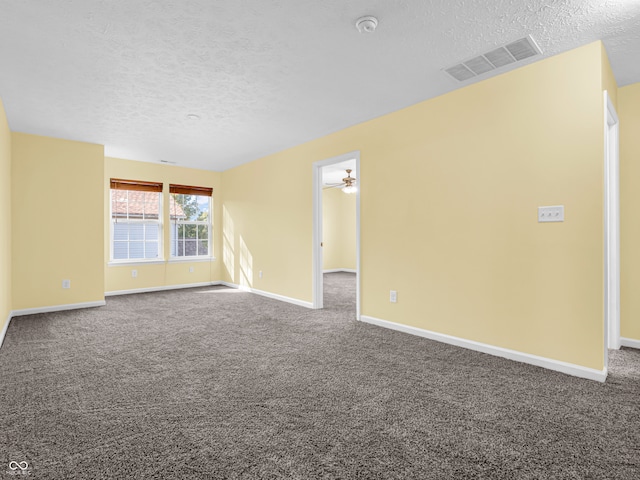 unfurnished room featuring a textured ceiling, carpet floors, and ceiling fan