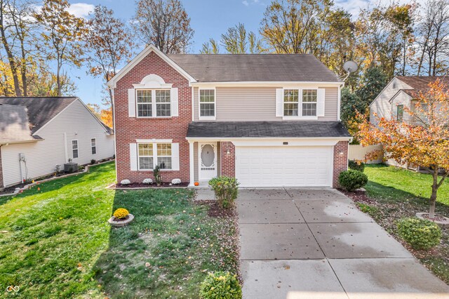 11411 Shady Hollow Ln, Indianapolis, IN 46229 - traditional home featuring brick siding, concrete driveway, a garage, and a front yard
