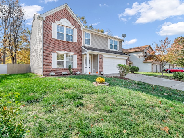 view of front of house with a front yard and a garage