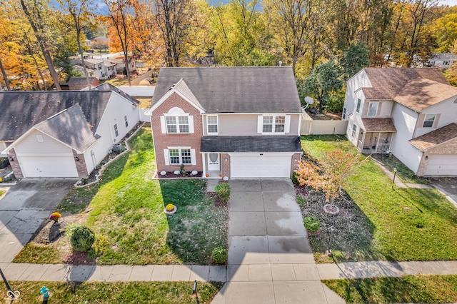 11411 Shady Hollow Ln, Indianapolis, IN 46229 - view of front of property featuring brick siding, concrete driveway, an attached garage, a residential view, and a front lawn