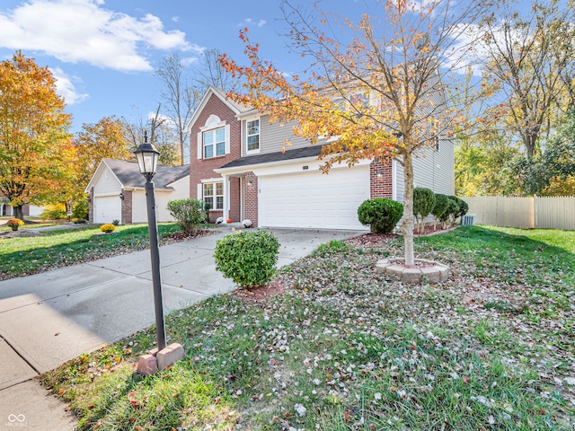 view of front of home featuring a front yard and a garage