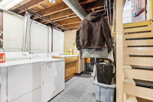 laundry room with separate washer and dryer and sink