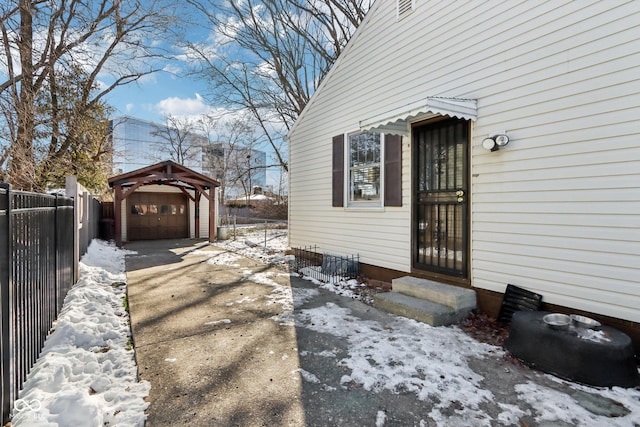 view of snow covered property entrance