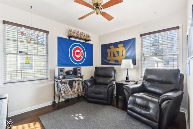 sitting room featuring dark hardwood / wood-style flooring and ceiling fan