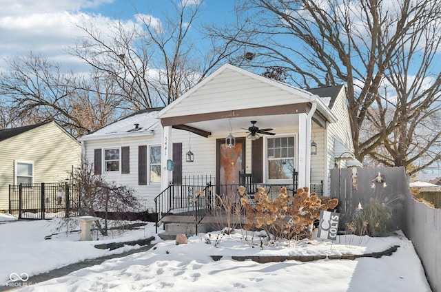 bungalow-style home featuring a porch and ceiling fan