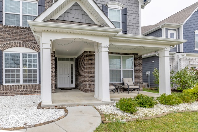 entrance to property featuring covered porch