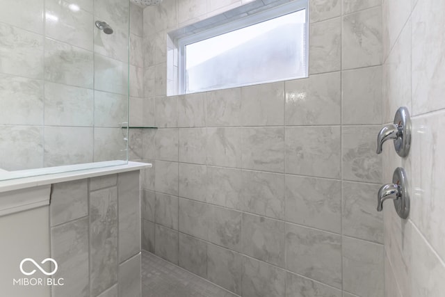 bathroom with tiled shower