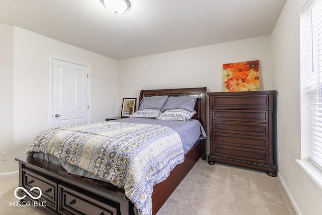 bedroom with light carpet