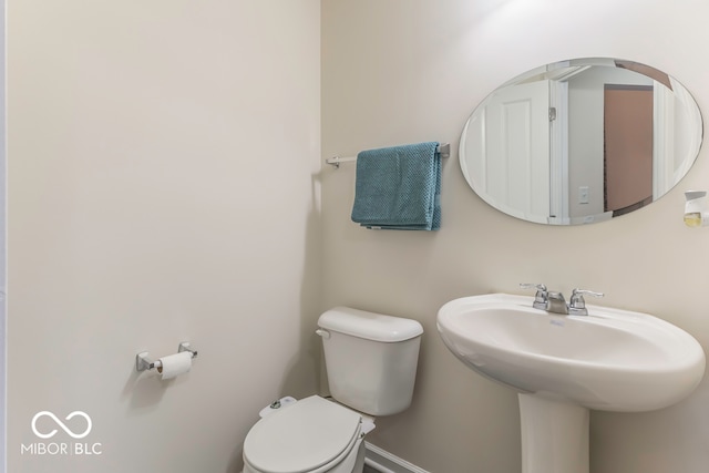 bathroom featuring sink and toilet