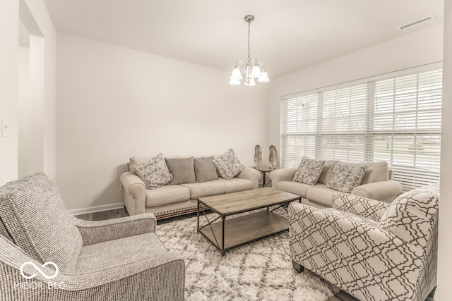 living room featuring an inviting chandelier