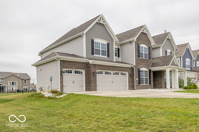 view of front of property featuring a front yard and a garage