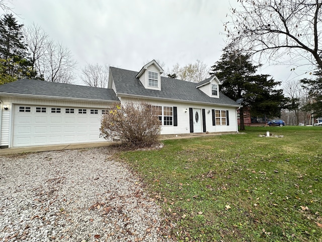 new england style home with a garage and a front lawn